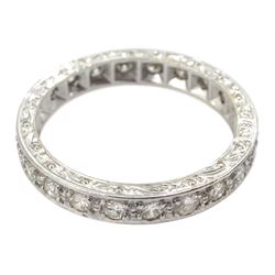 Mid 20th century white gold round diamond full eternity ring, twenty-two diamonds, with engraved decoration to the sides, stamped 18ct