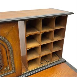 19th century Anglo-Indian teak/camphor twin pedestal desk, raised back fitted with pierced and foliate carved panelled sliding doors, enclosing pigeonholes and correspondence drawers, rectangular top with ebonised banding and moulded edge over a lunette carved frieze, fitted with nine drawers, decorated with carved and pierced mounts