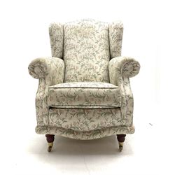 Traditional high wing back upholstered armchair 