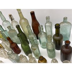 Collection of various vintage glass bottles and stoppers, including advertising bottles, sauce bottles and medical bottles etc