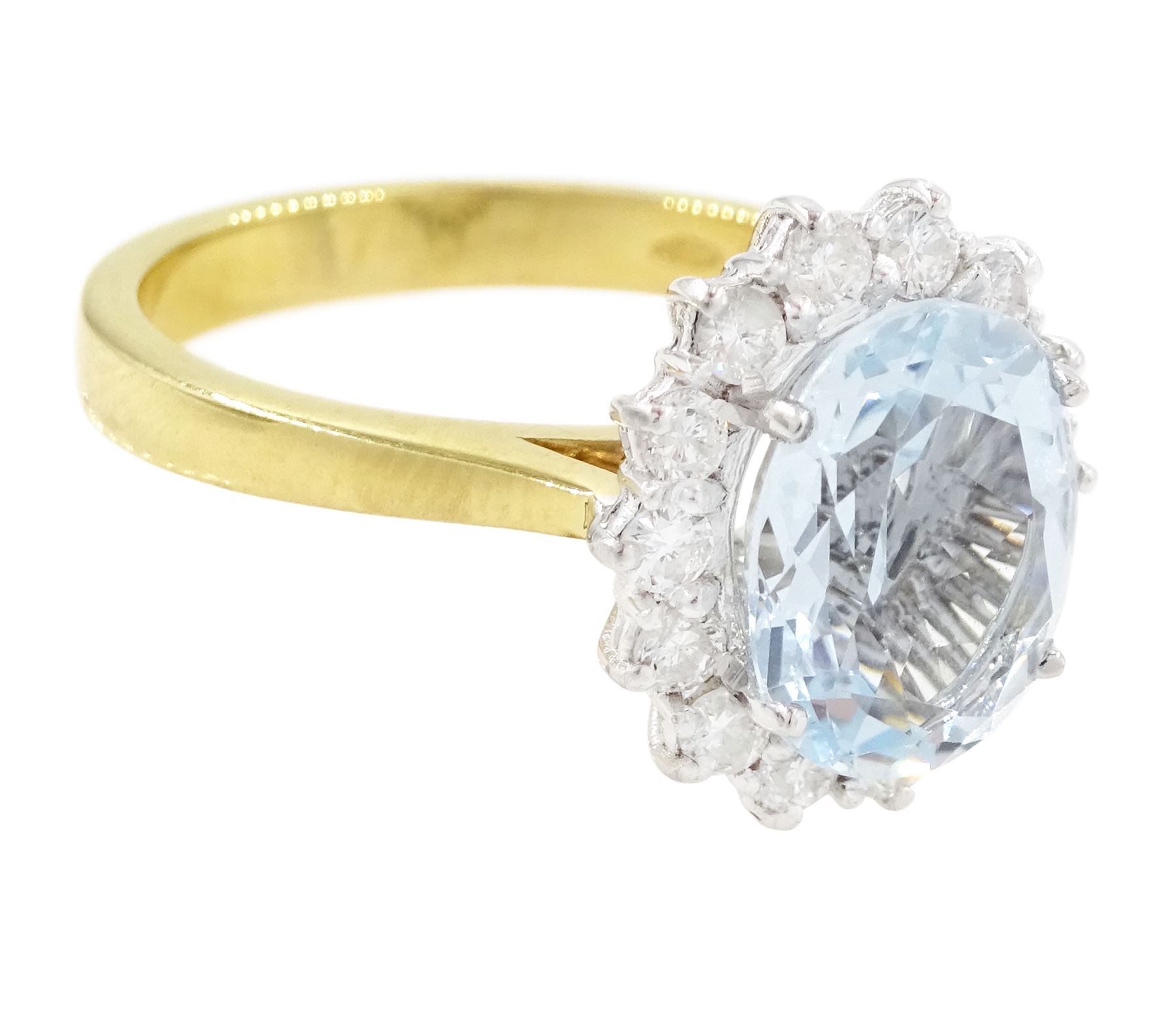 18ct white gold aquamarine and diamond cluster ring, single oval cut aquamarine of approx 2.30 carat, surrounded by fourteen round brilliant cut diamonds, London 2022, total diamond weight approx 0.45 carat