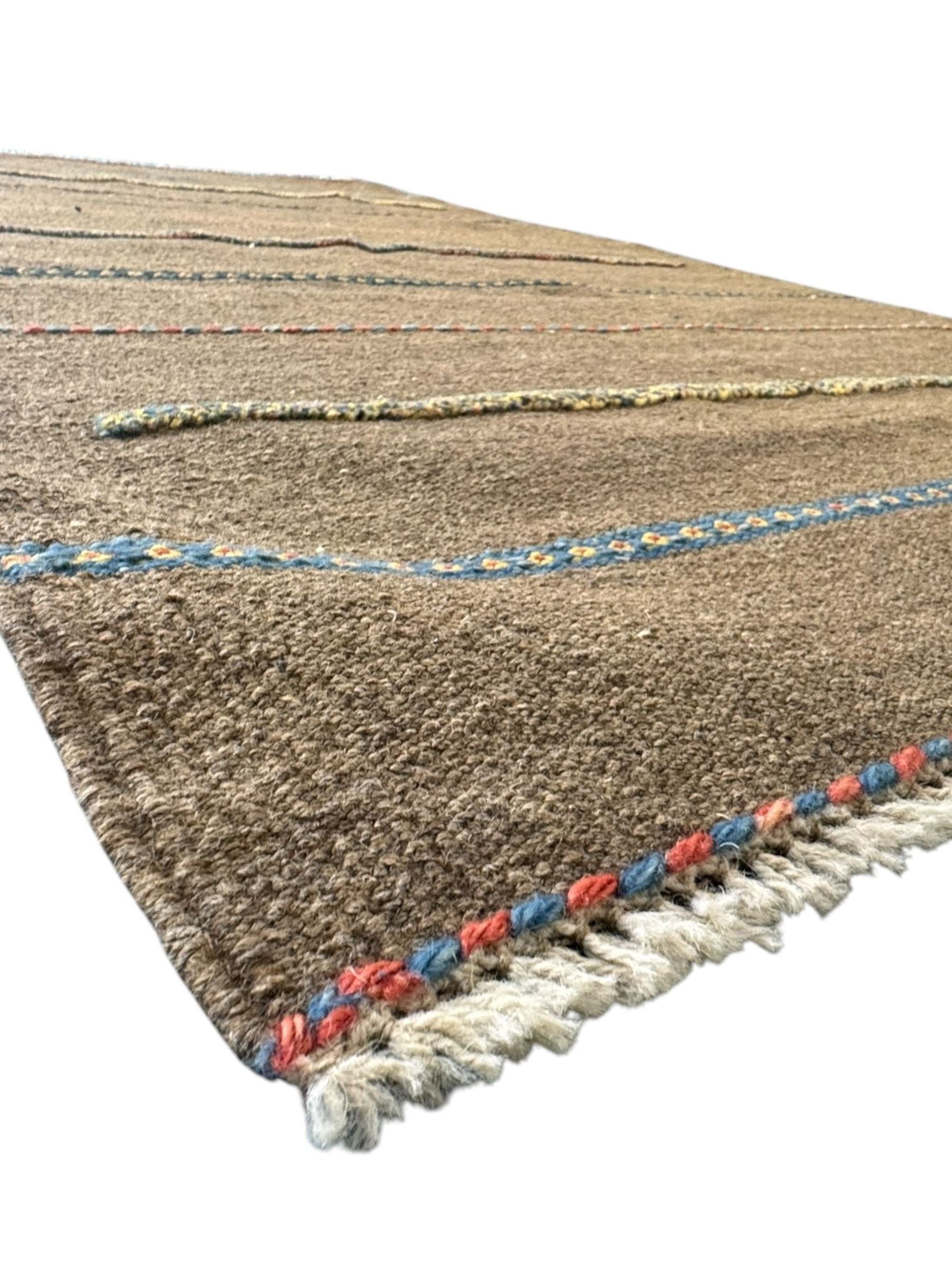 Shiraz Kilim rug, decorated with multi-coloured and patterned horizontal lines 