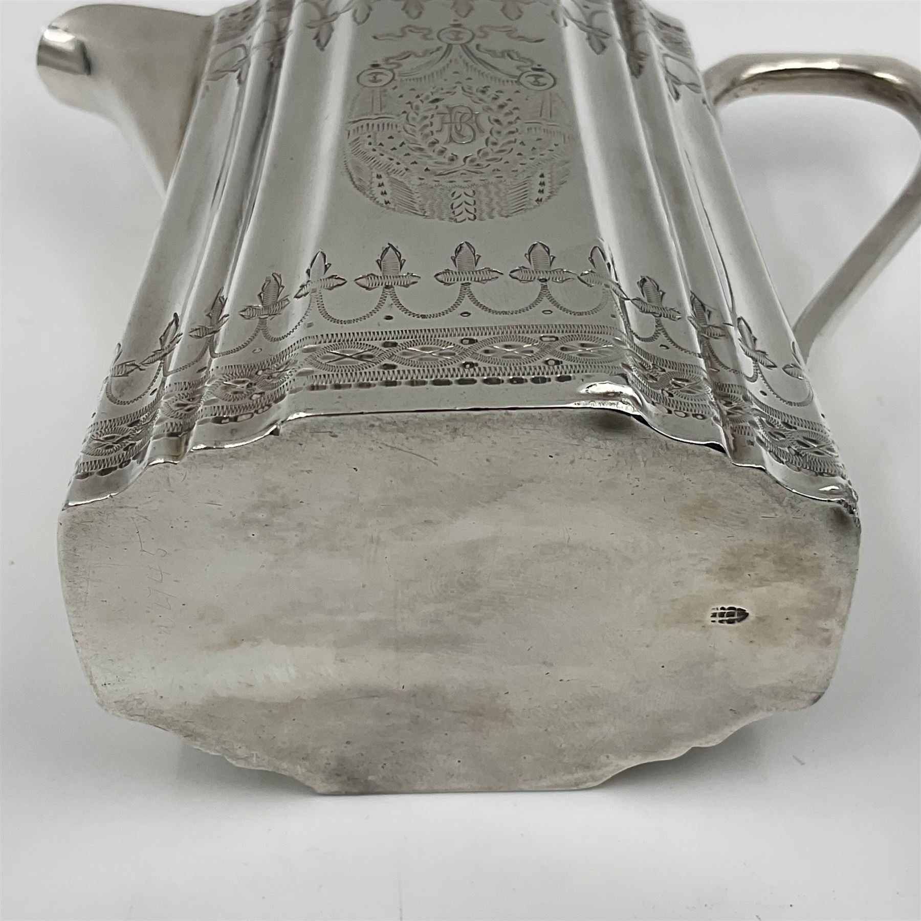 Victorian three-piece silver tea service, comprising teapot, twin handled open sucrier and milk jug, of oval form with shaped rim and C handles, each engraved with crests and bands of strapwork decoration, the milk jug and sucrier with gilt interiors, hallmarked Josiah Williams & Co, Exeter 1881, the teapot with ivory insulators and finial, all contained with a tooled leather, blue silk and velvet lined fitted case, retailed by West & Sun, Dublin 
This item has been registered for sale under Section 10 of the APHA Ivory Act