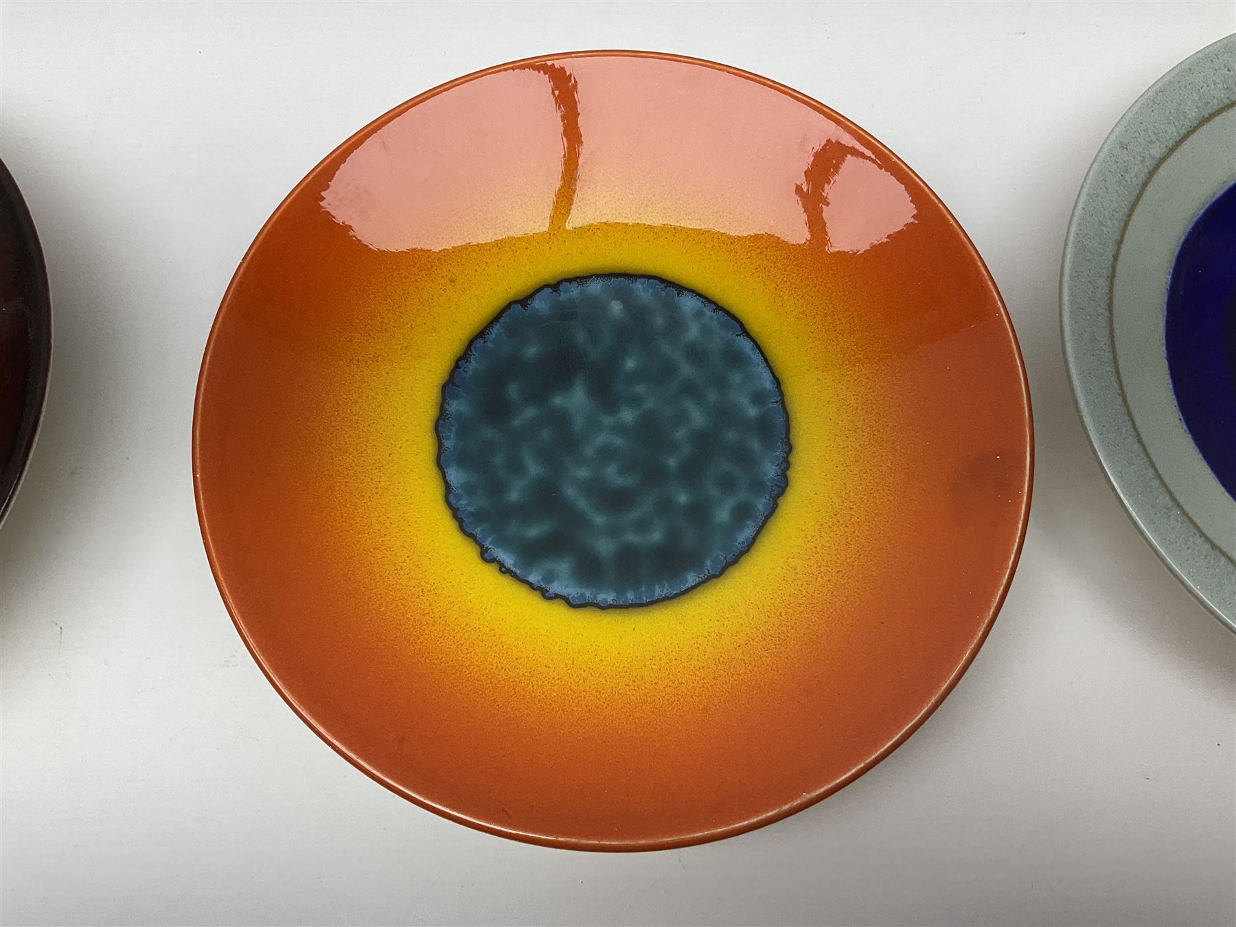 Poole Pottery The Planets, set of nine chargers 'The Planets, by Alan Clarke, comprising Mars, Mercury, Neptune, Venus, Uranus, Pluto, Jupiter, Saturn and Earth, all with original boxes and certificate, D27cm 