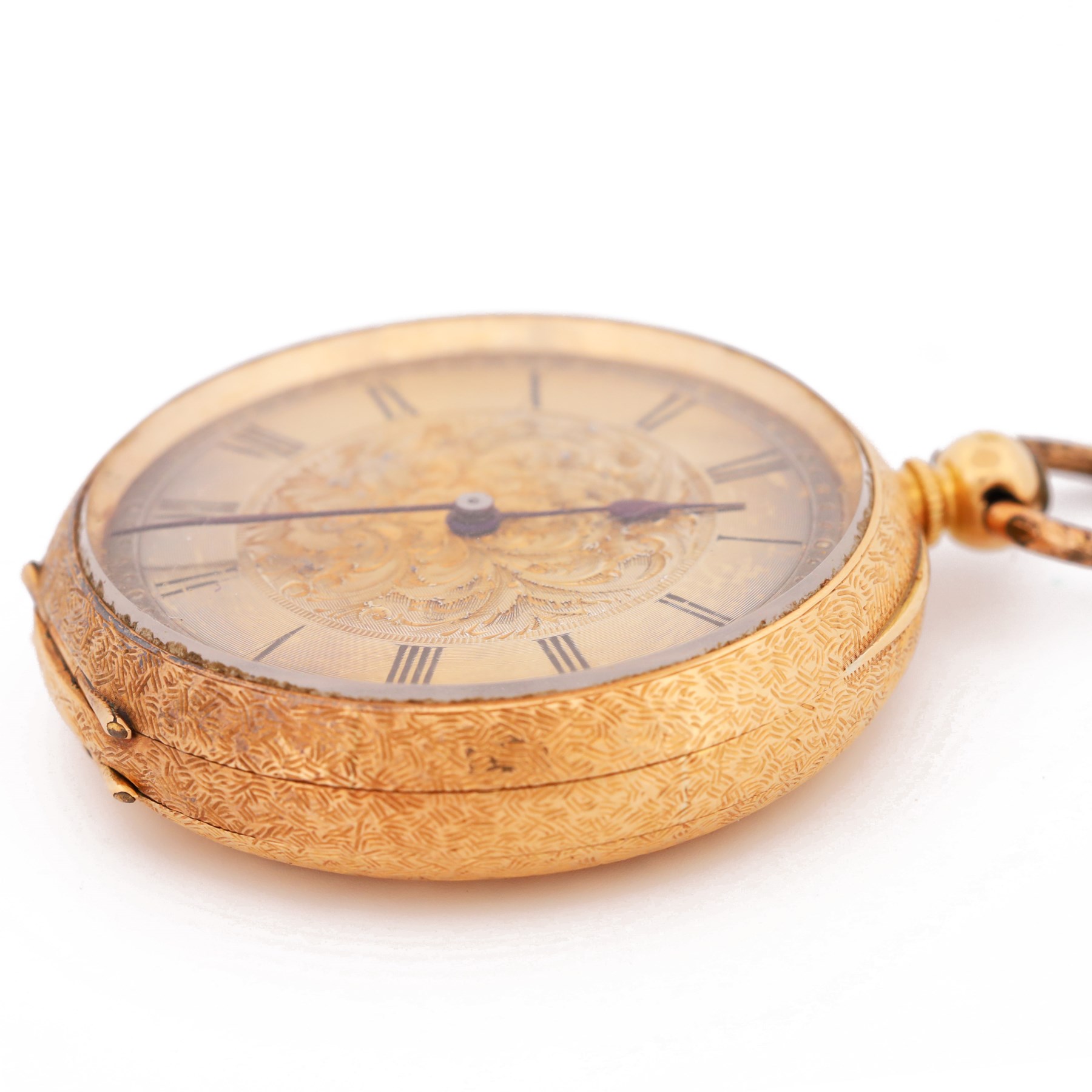 19th / early 20th century 18ct gold open face key wound pocket watch, gilt dial with Roman numeral hour markers, engraved foliate case with empty cartouche, the inner dust cover engraved H. Samuel, Manchester, stamped K18 with Helvetia hallmark
