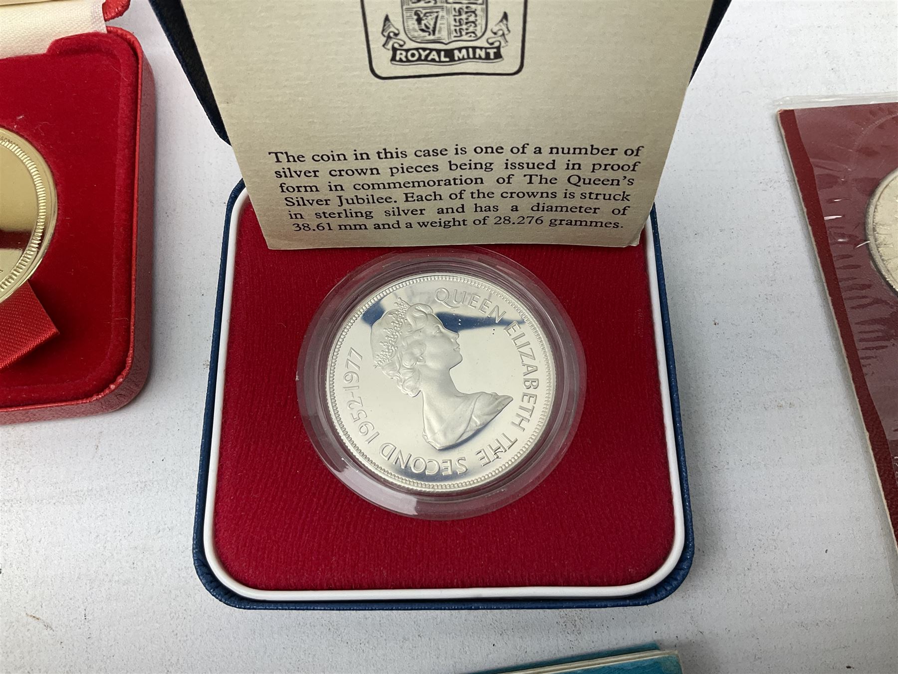 Great British and World coins, including Canadian 1975 dollar, United States of America 1975 proof set and bicentennial silver uncirculated set 1776-1976, Queen Elizabeth II Gibraltar 1977 sterling silver proof twenty-five pence, cased with certificate, New Zealand 1979seven coin set in blue wallet,  GB pre-decimal coins etc