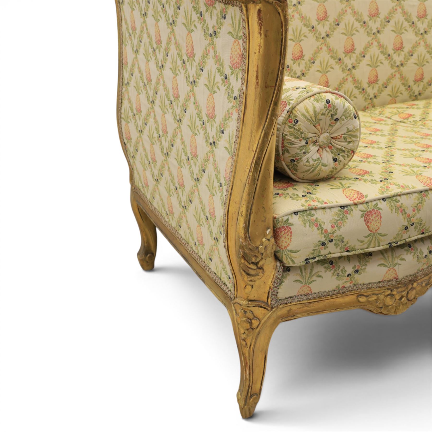 Louis XV design giltwood framed settee, the frame with applied foliate detail,  three loose seat cushions, upholstered in pineapple patterned fabric