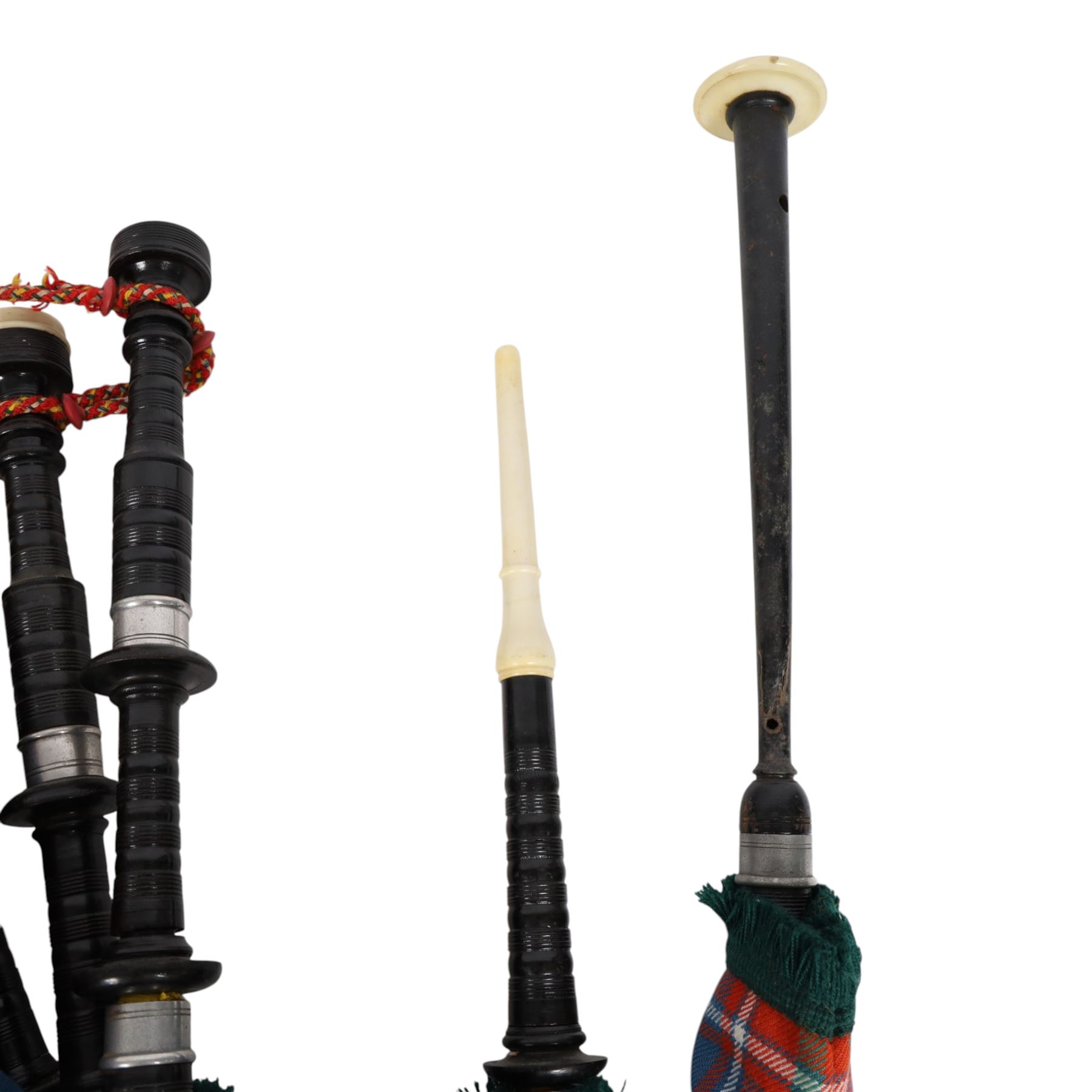 Set of ebonised wooden bagpipes, with new bag in Cameron of Lochiel tartan, contained in leather suitcase with initials PAJ to cover