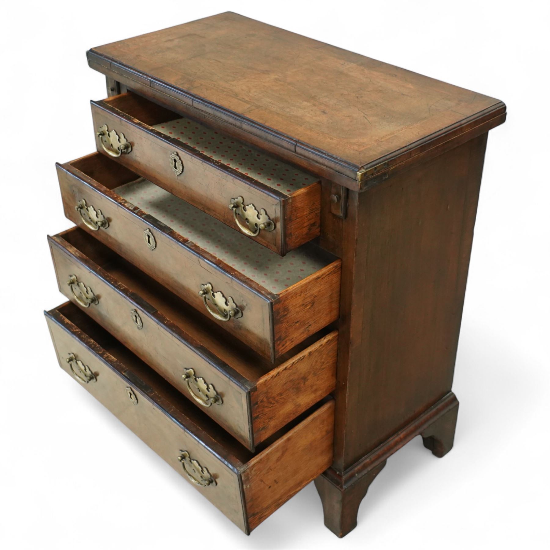 Mid-19th-century Georgian-style burr walnut bachelor's chest with feather-banding, hinged rectangular brushing slide above four graduated long drawers with brass batwing handles and escutcheons, raised on bracket feet  