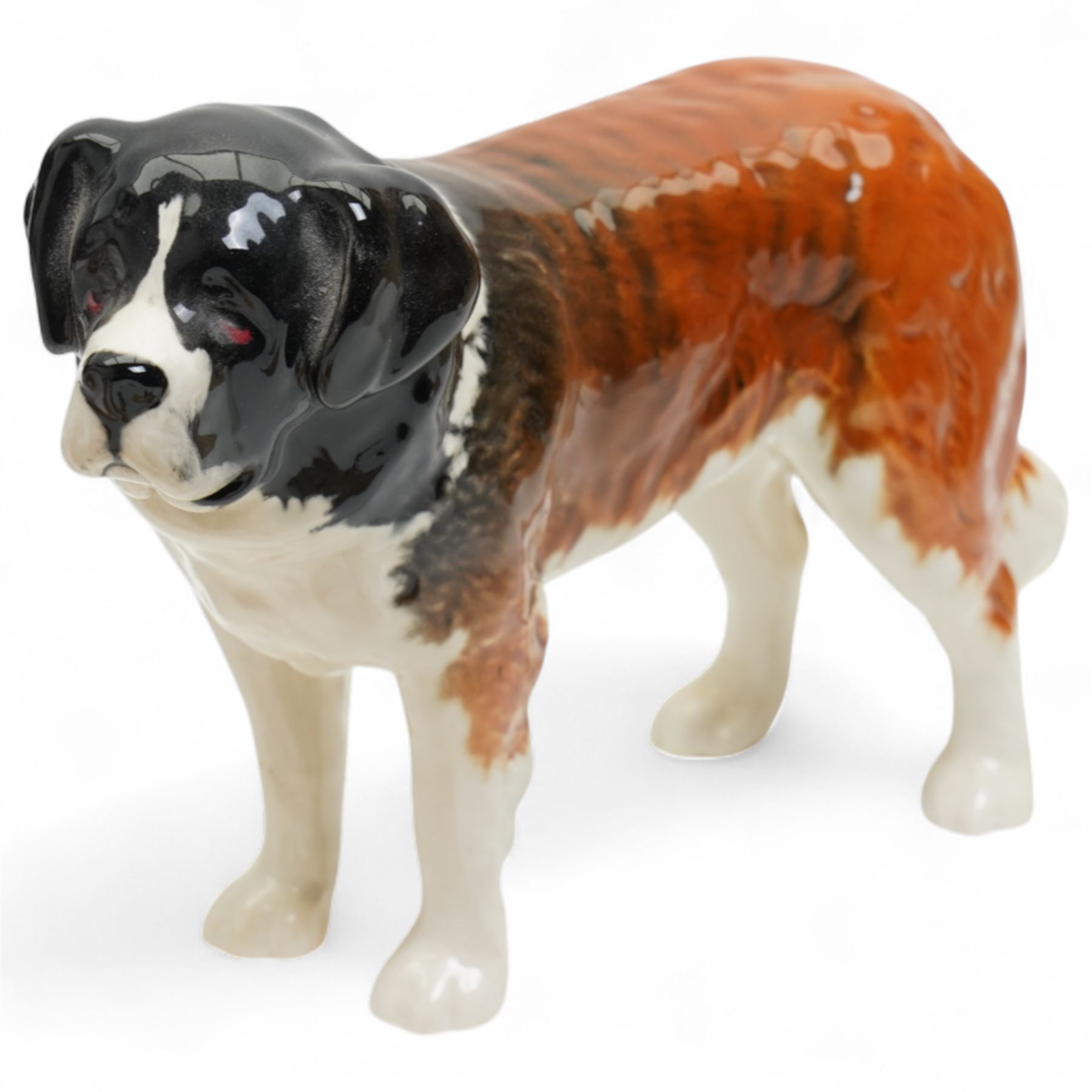 Six Beswick dogs comprising St Bernard No.2221, Greyhound No.972, Alsatian No.969. Whippet No.1786B, Cairn No.1055A and Retriever No.1855, two Beswick foxes and a harnessed horse