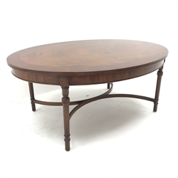 Wade Georgian style oval coffee table, turned tapering reeded supports joind by shaped 'X' framed stretchers, W118cm, H49cm, D90cm
