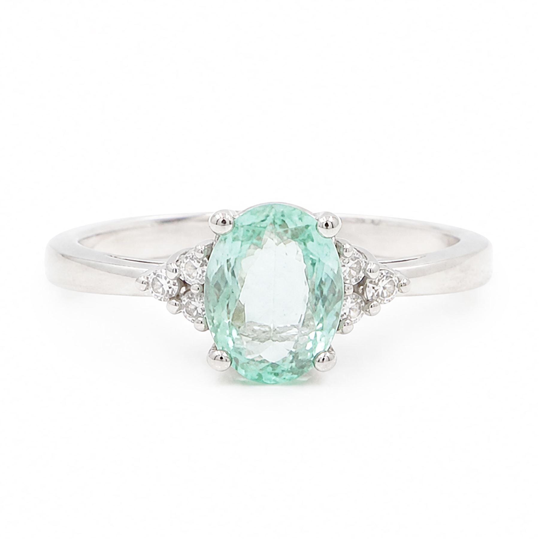 18ct white gold Paraiba tourmaline and diamond ring, single oval cut tourmaline of approx 0.95 carat, with three round brilliant cut diamonds set either side, Birmingham 2008