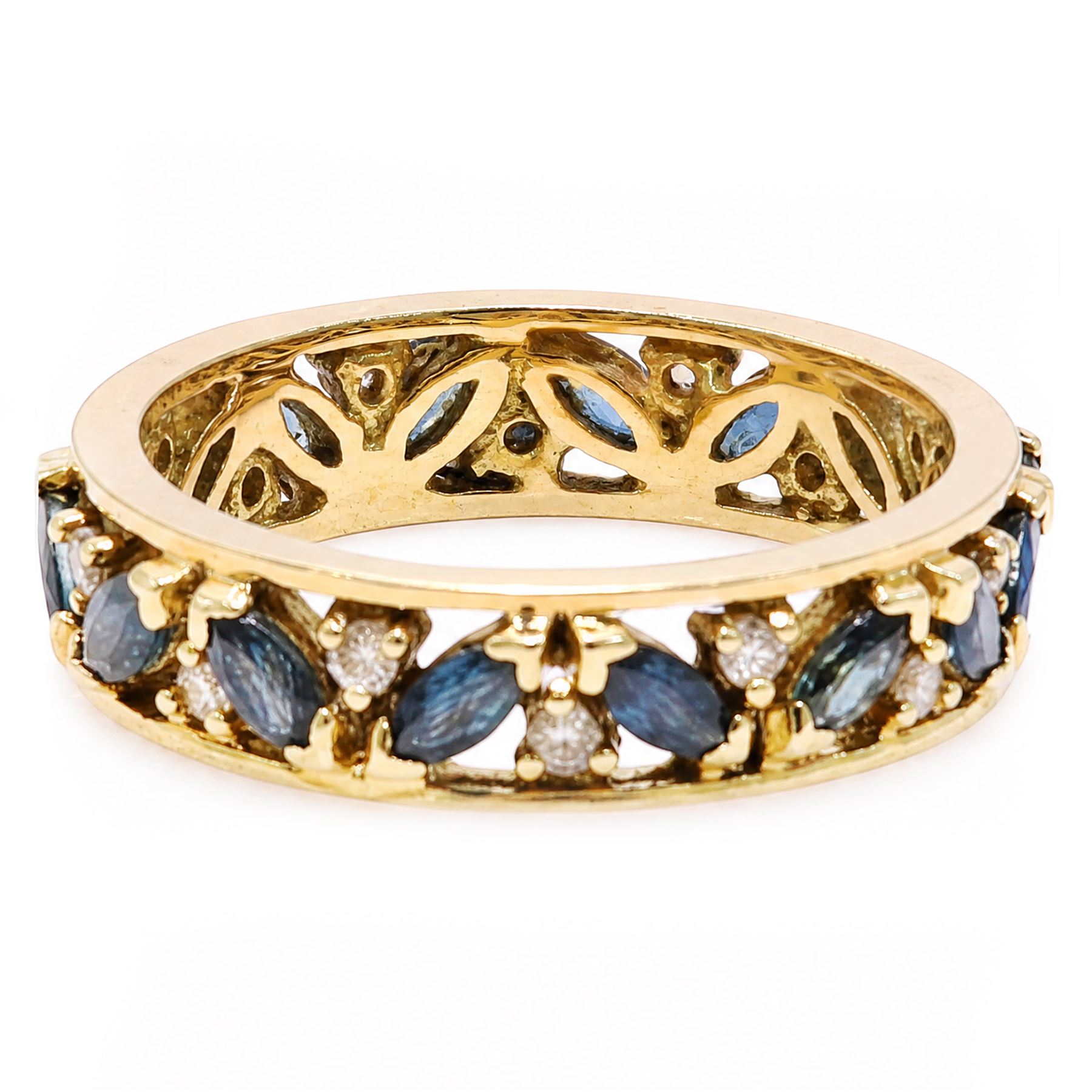18ct gold sapphire and diamond full eternity ring, sixteen marquise cut sapphires, each spaced by a round brilliant cut diamond, London import mark 1992