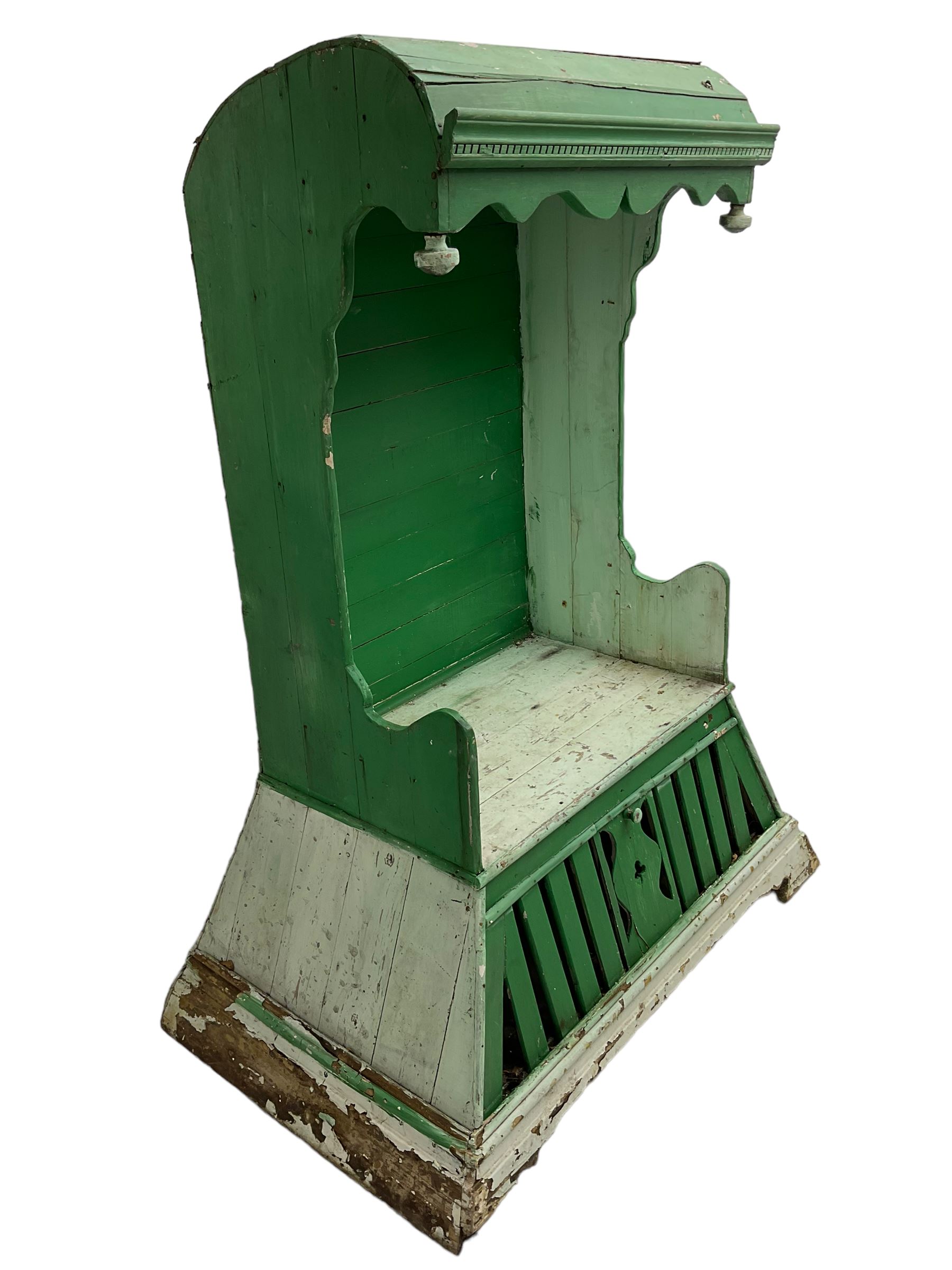 19th century painted pine hen coop settle, overhanging arched canape with dentil moulding and shaped edge, the panelled seat over a triangular platform base with removable hen-coop door, in green and white finish