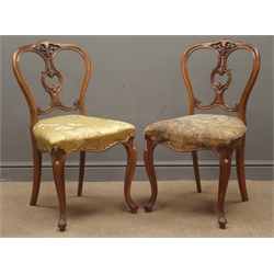  Pair Victorian walnut bedroom chairs, pierced and carved backs, upholstered serpentine seats, cabriole supports, (2)  