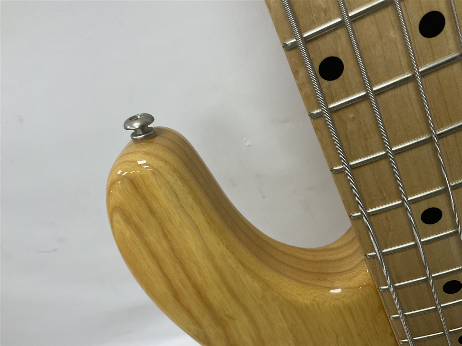 Ernie Ball Music Man Sting Ray 4 string bass guitar, in natural finish with roasted maple neck and tortoiseshell effect scratch guard, serial no 87485, in black Music Man hard case, guitar L114cm