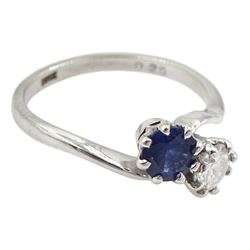 18ct white gold round brilliant cut diamond and sapphire crossover ring, stamped 18ct, diamond approx 0.45 carat, sapphire approx 0.45 carat