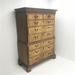 Early 19th century mahogany chest on chest, projecting Greek key cornice with two short and six long graduating drawers, canted blind fret corner, ogee supports, W124cm, H170cm, D57cm