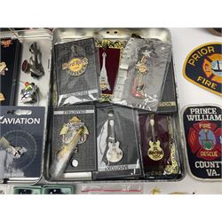 Quantity of pin badges and sew on patches to include Robertson’s Golly, featuring pre-WW2 examples, The Magic Roundabout, Hard Rock Cafe etc 