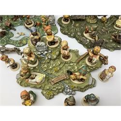 Collection Hummel figures by Goebel, together with three hummel landscapes, Hummel Quelle, Hummel Weiher and Hummel Garten