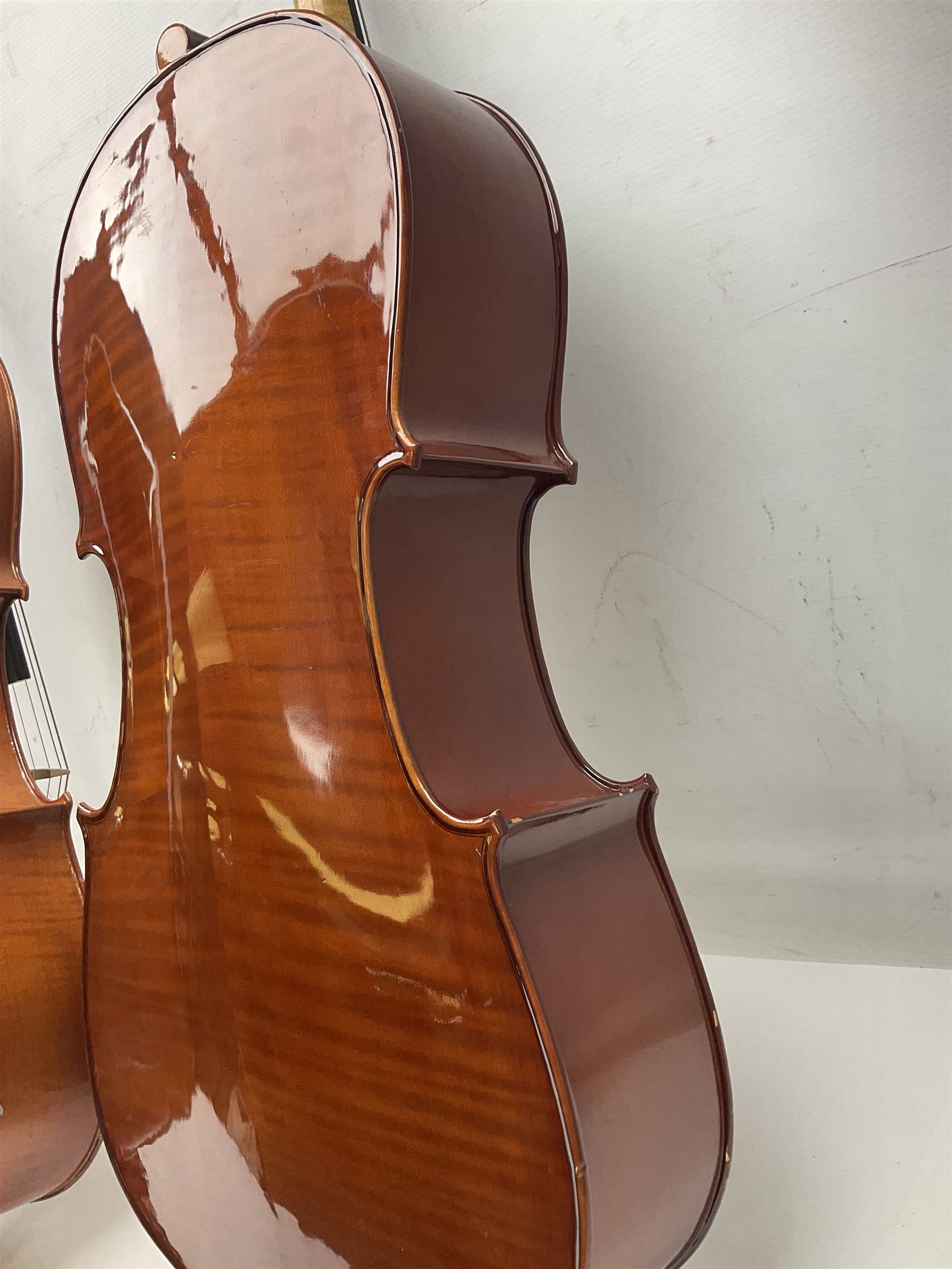 Modern Hungarian half-size cello with 69cm two-piece maple back and ribs and spruce top L114cm overall; and Stentor half size cello bearing label 'The Stentor Student II'; each in soft carrying case (2)