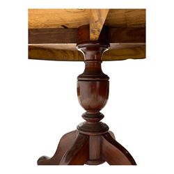 Pakistan carved hardwood brass inlaid circular dining table, and four rail back chairs with saddle seats