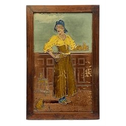 20th century large Burmantofts Faience architectural tile plaque, The Maide at The Inn, designed by William Neatby, of rectangular form depicting a female figure holding a tray, with cat seated at her feet, titled lower left corner, within mahogany frame with easel style support verso, plaque 48.5cm x 29cm

Born in 1860 in Barnsley, Yorkshire, William James Neatby worked at Burmantofts Pottery  designing ceramic tiles for six years. He then went on to work at Doulton & Co, and in 1902 designed the tiles for the interior of Harrods Meat Hall. 