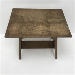  Early 20th century Arts & Crafts oak occasional table, rectangular top on four out splayed tapered supports, side splats pierced with leaf motif, with undertier, label underneath 'Denby & Spinks, Leeds', 46cm x 41cm, H50cm  