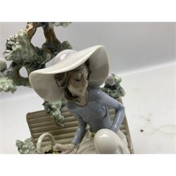 Lladro figure, Sunday in the Park, modelled as a woman sat on a bench under a tree, sculpted by Antonio Ramos, no 5365, year issued 1986, year retired 1986, H22cm
