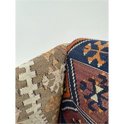 Late 20th century beech framed wingback armchair, sprung seat and back upholstered in kilim cover, acanthus carved cabriole supports with ball and claw feet