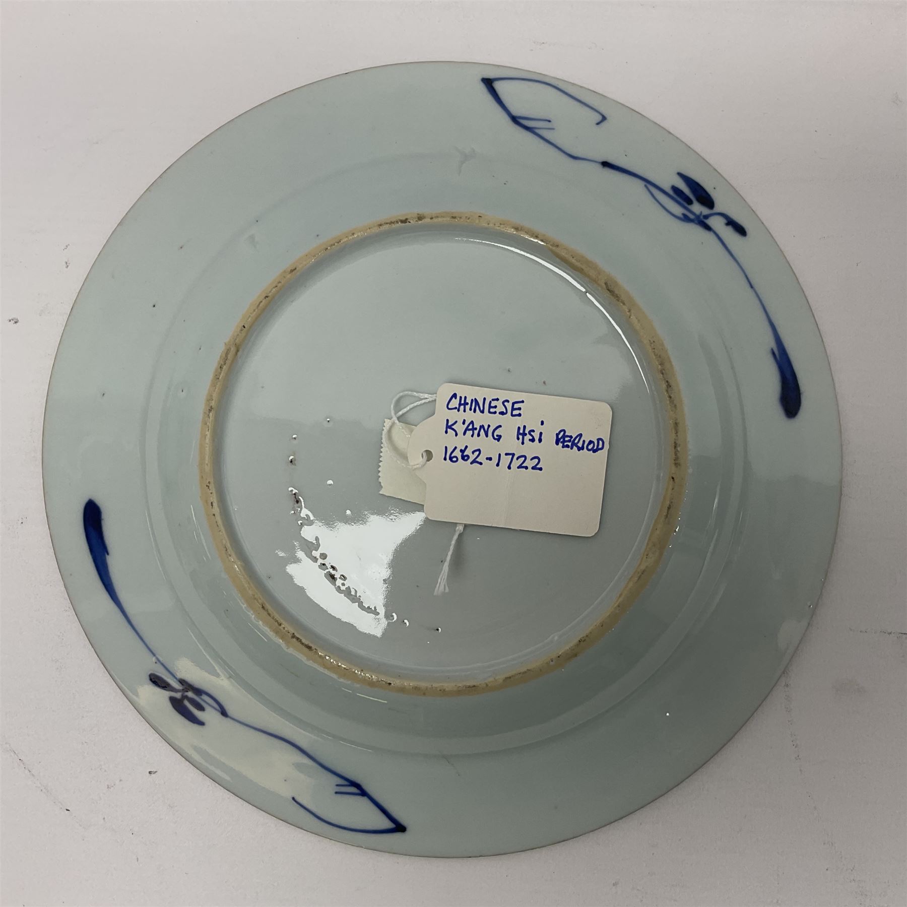 Japanese Meiji period Arita blue and white plate, of circular form, painted with riverside landscape and bird upon flowering branch, with character mark beneath, D24.5cm, together with two 18th century Chinese blue and white plates, each painted with floral design, each approximately D22.5cm