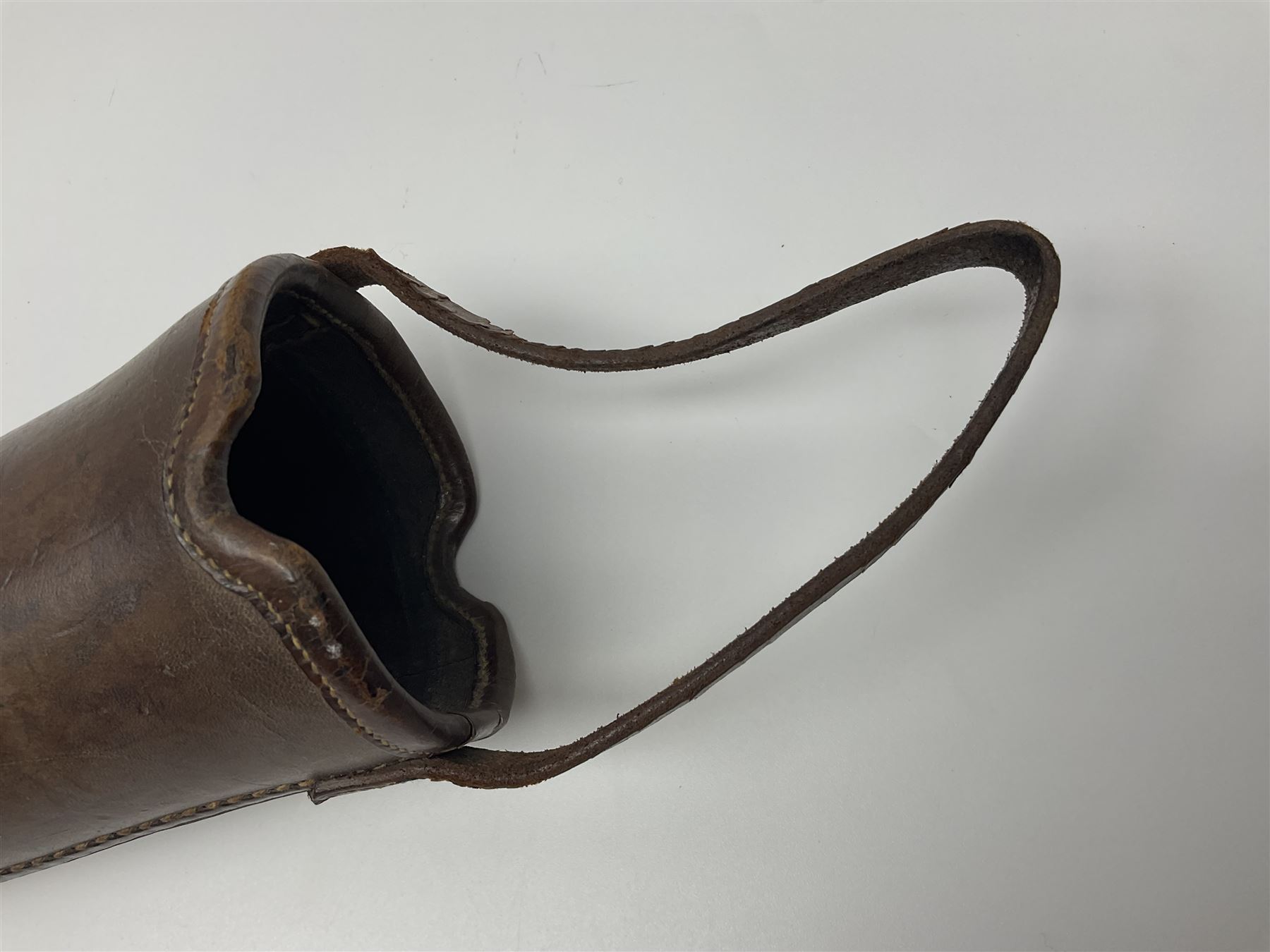 19th century telescopic hunting horn, the bell engraved 'The Beaufort', with makers mark Kohler & Son, makers, 61 Victoria Street, Westminster (from Covent garden) London, in a leather sheath, horn full extended L91cm 