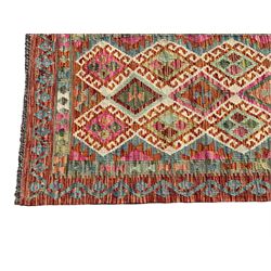 Anatolian Turkish Kilim multi-colour runner rug, decorated with all over geometric lozenges with ivory outline, the banded border with repeating trailing patterns