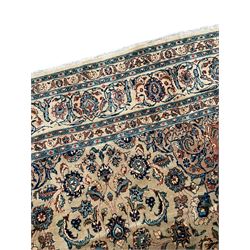Persian Kashmar camel ground carpet, palmette rosette medallion on a field of curling leafy branches and stylised plant motifs, scrolling border decorated with further palmettes, within floral pattern guard stripes