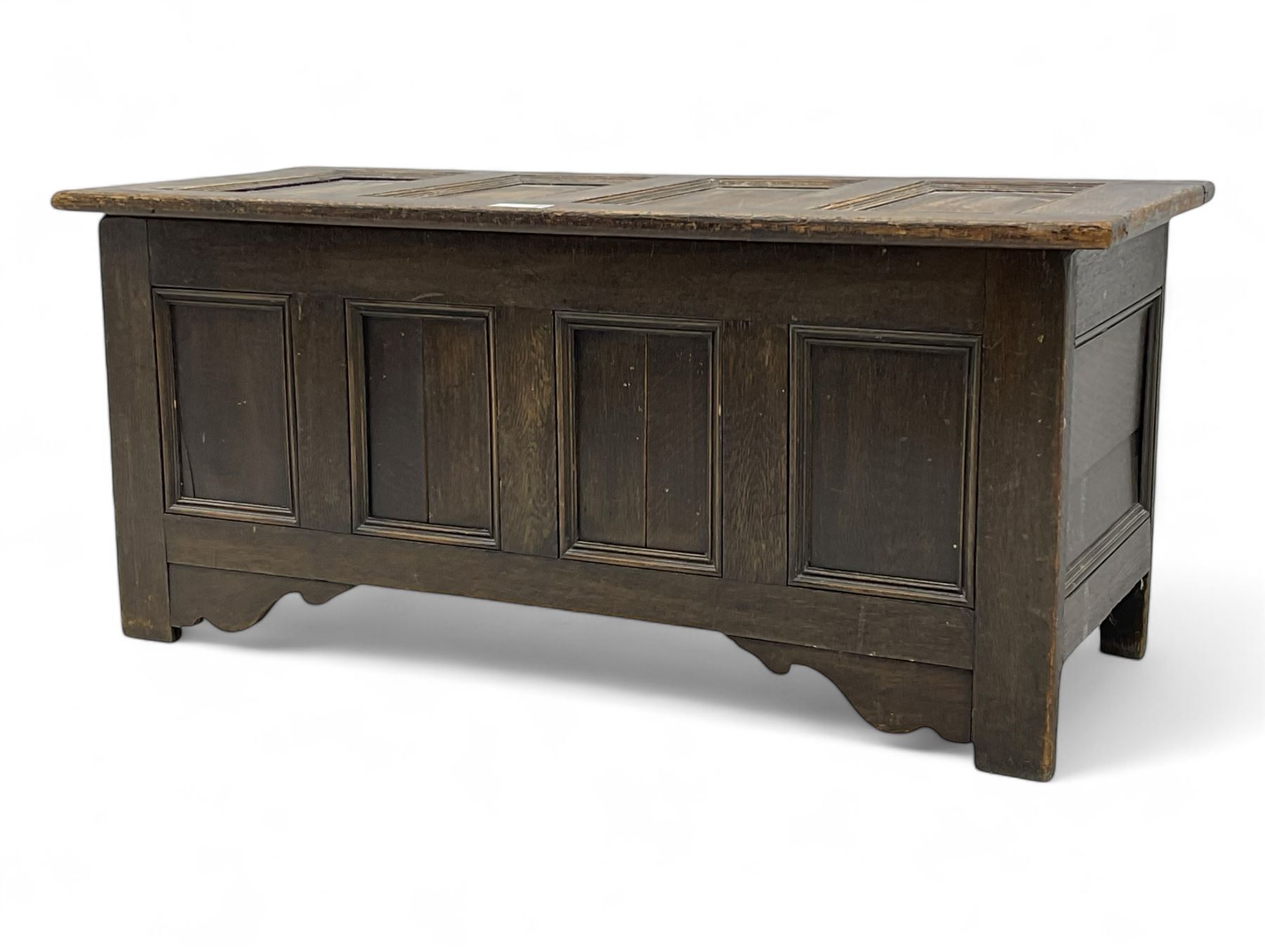18th century design oak coffer, four panel hinged lid over four panel front, panelled sides, on stile supports with shaped brackets 