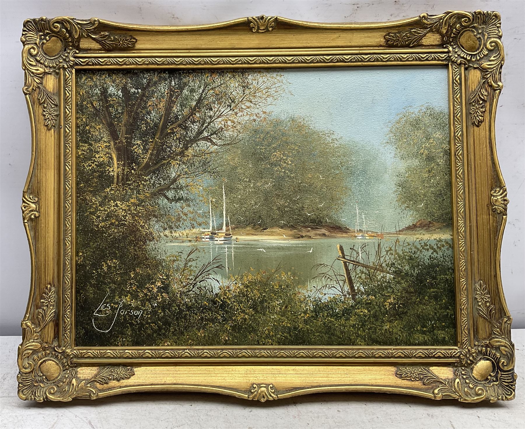 Les Parson (British 1945-): Young Boys Playing on the Lake and Moored Sailing Boats, two oils on canvas signed max 50cm x 76cm (2)