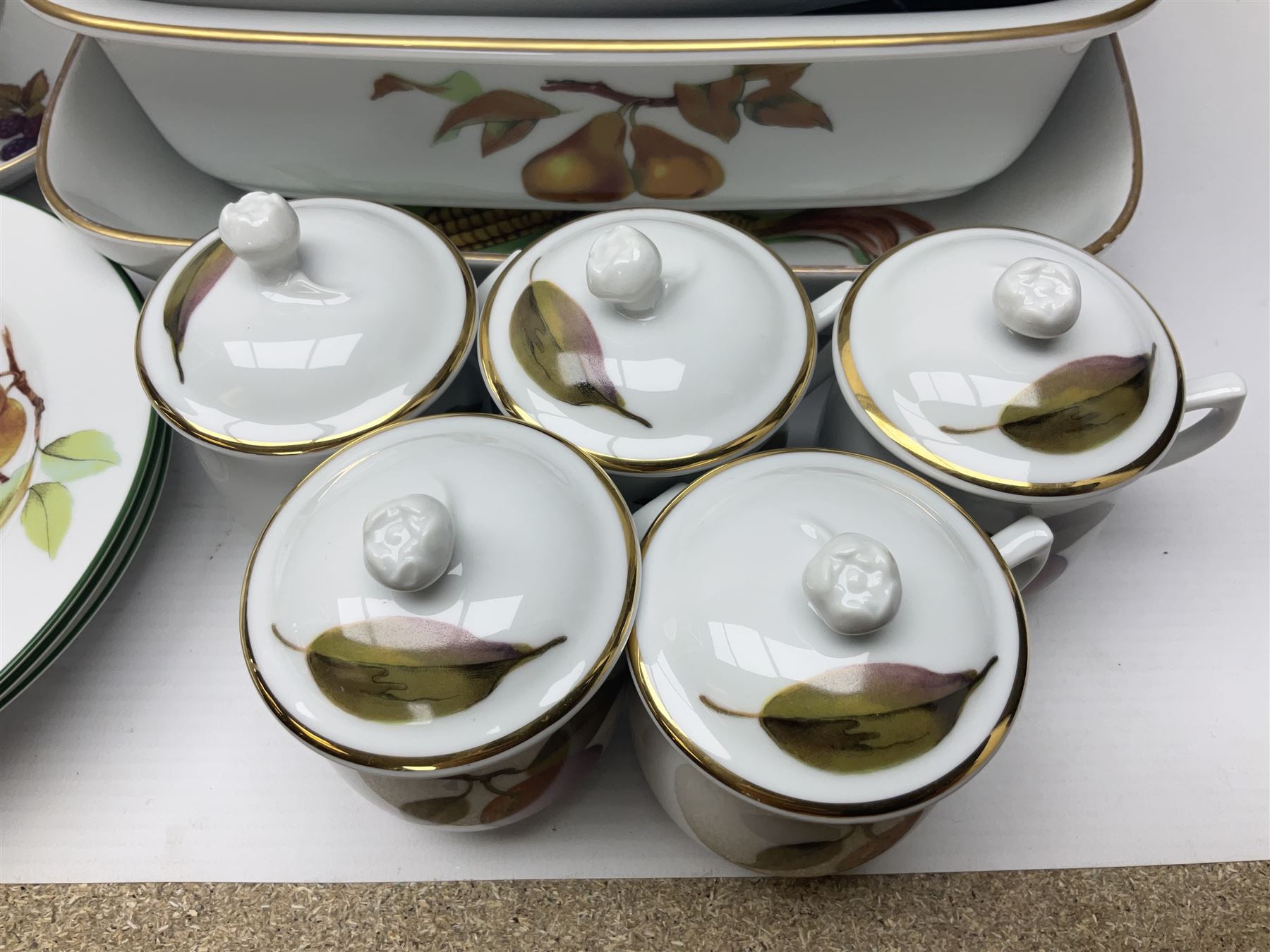 Royal Worcester Evesham pattern, including covered pot de cremes, twin handle tureen, serving dishes, flan dishes, side plates etc  