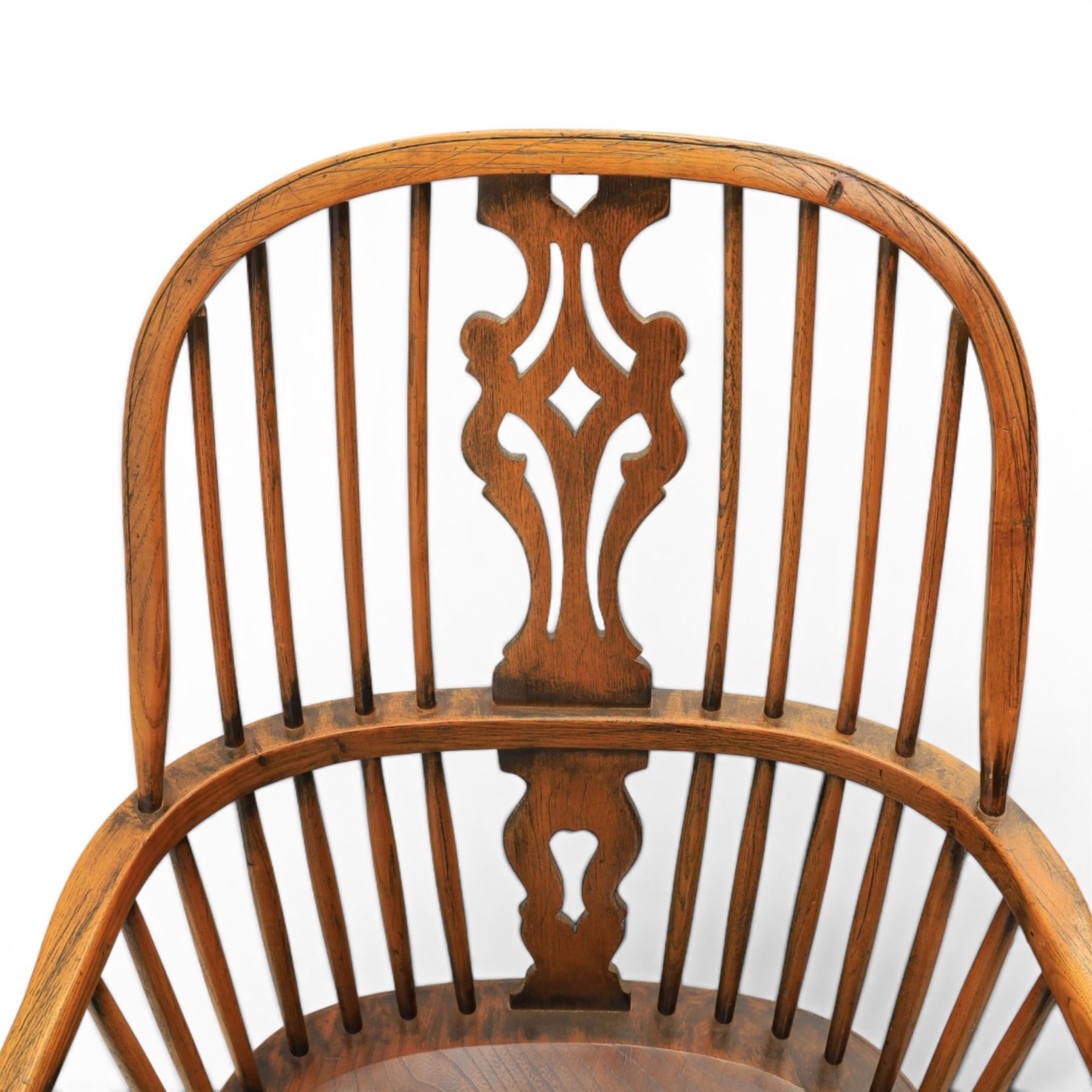 Pair of high back Windsor armchairs, fleur de lis back splat, dished seat, caroline stretcher