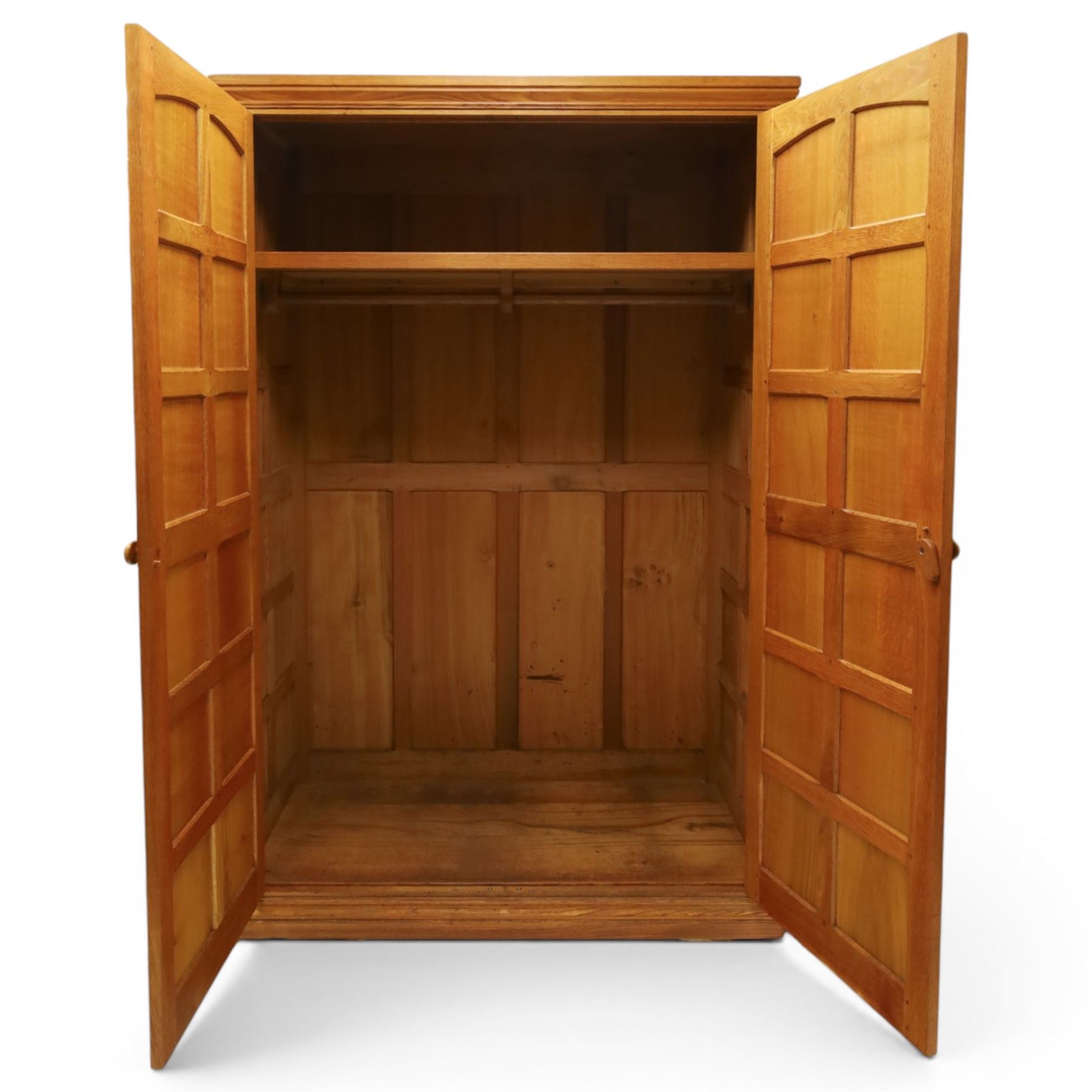 Beaverman - oak double wardrobe, enclosed by twin multi-panelled doors, Yorkshire Rose carved handles, the interior fitted with shelf and hanging rail, with signature carved beaver, by Colin Almack of Sutton, near Thirsk