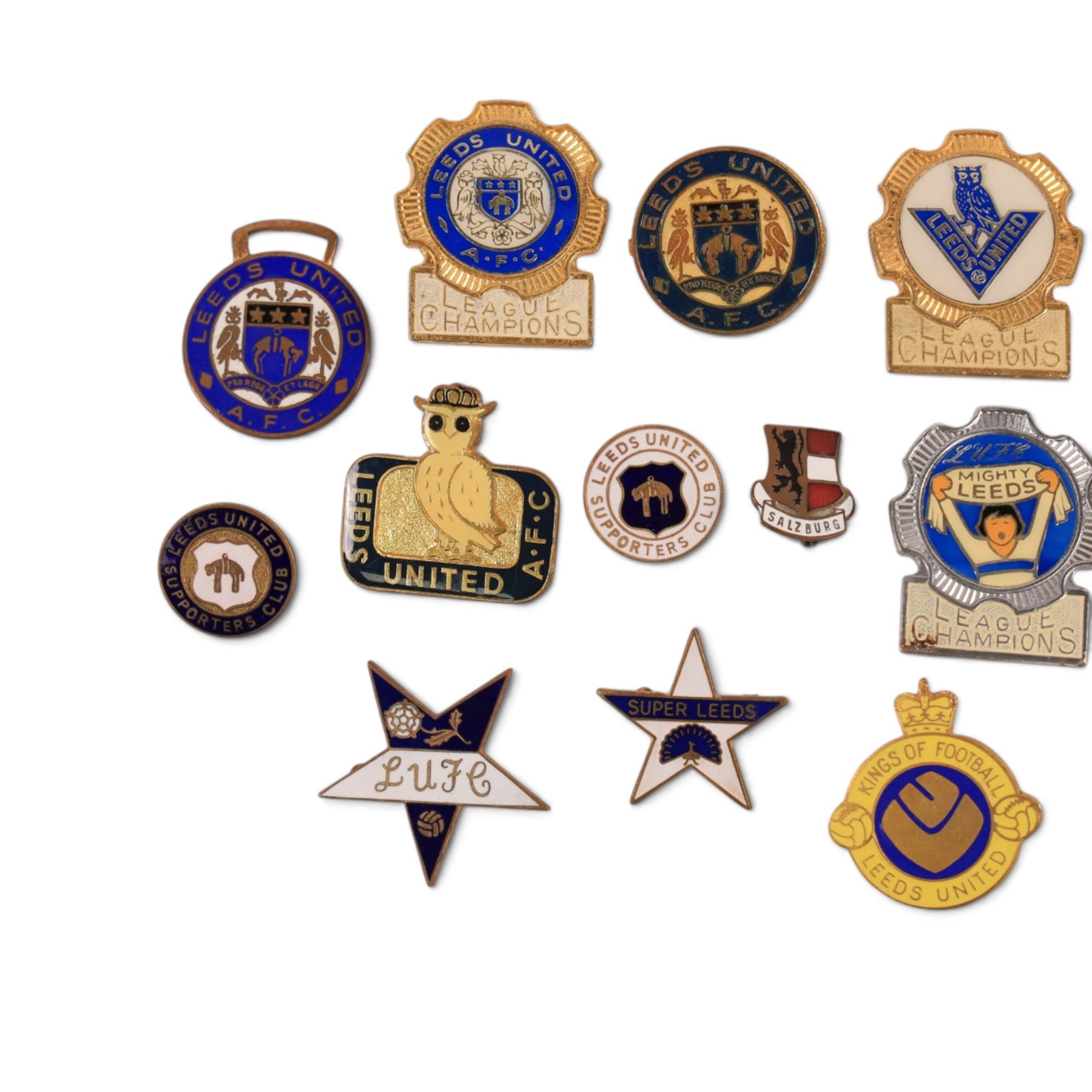 Collection of Leeds United enamel badges, including League Champions and League Winners examples, and a embroidered LUAFC patch