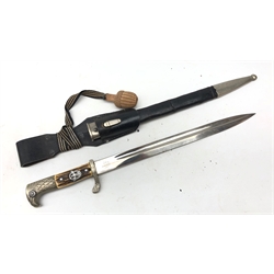  A WWII German Third Reich Police dress bayonet, 33cm fullered blade stamped Alexander Coppel Solingen, and scale Trade Mark, hilt with stag horn slab grip and applied eagle and swastika, oak leaf cast guard stamped 17 and eagle pommel, L45cm in nickel mounted brown leather scabbard with frog, and knot   