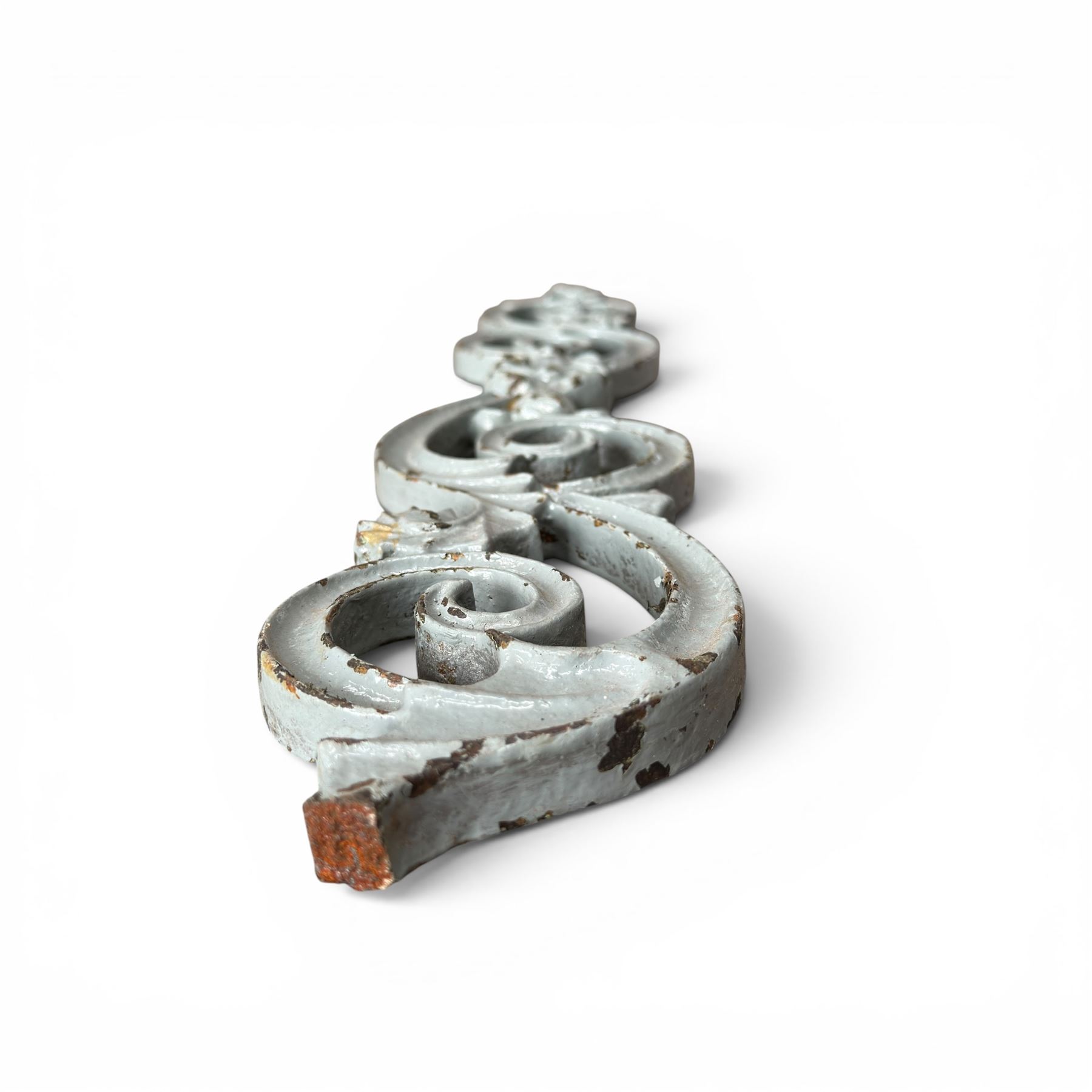 Set of eleven 19th century cast iron ornate stair or banister spindle supports, of scrolling form with scalloped decoration and flower-head motifs, in weathered duck-egg blue painted finish (11)