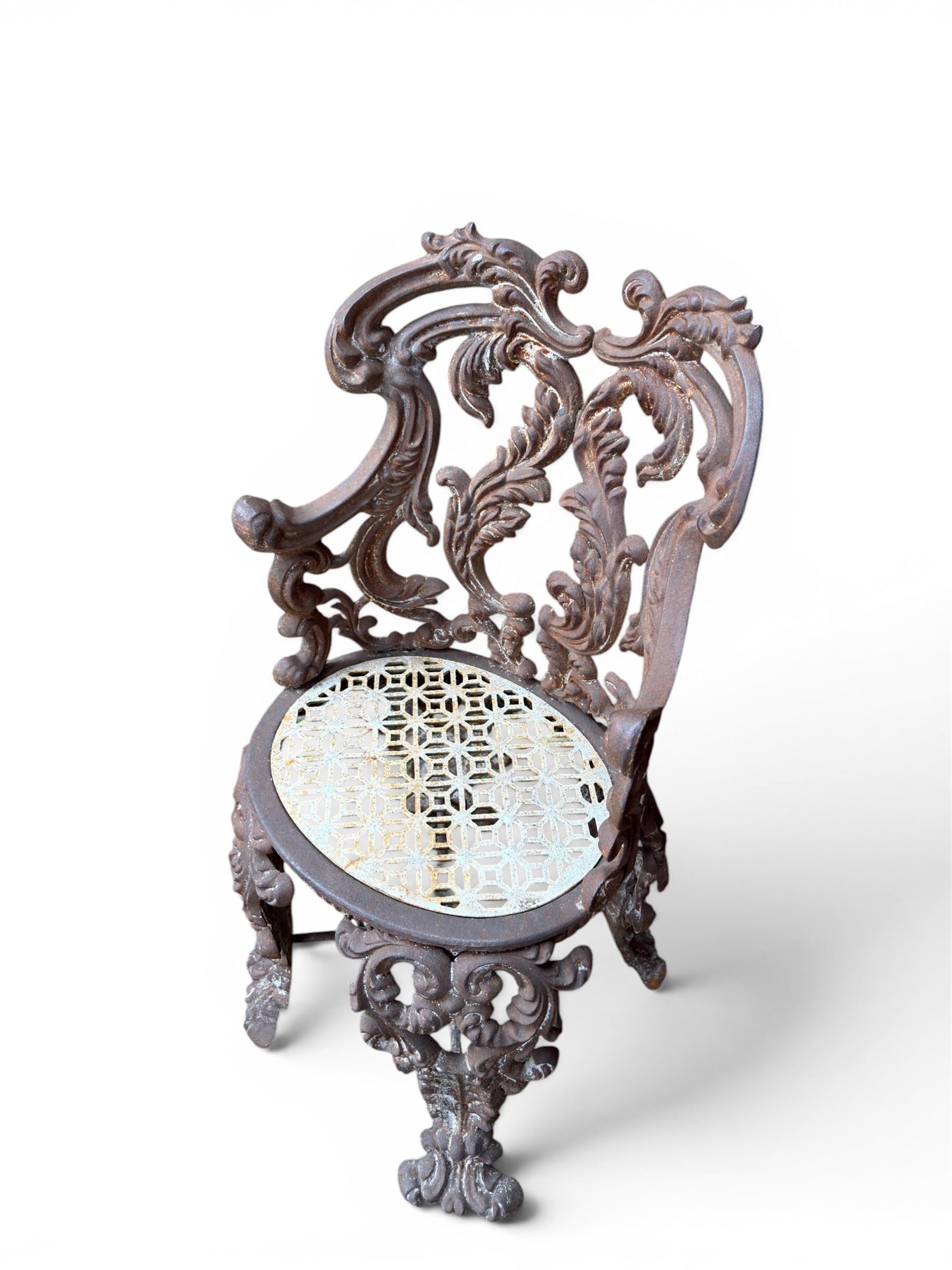 19th century Rococo Revival cast iron garden chair, pierced back comprised of scrolling acanthus leaves, over a pierced geometric white painted drop-in seat, raised on four acanthus and anthemion shaped cabriole supports united by X-frame stretcher