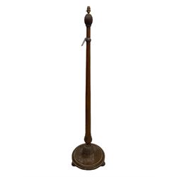 Early 20th century oak standard lamp base, of baluster form with fluted acorn finial and carved foliate decoration to the base, raised on circular plinth with bun feet