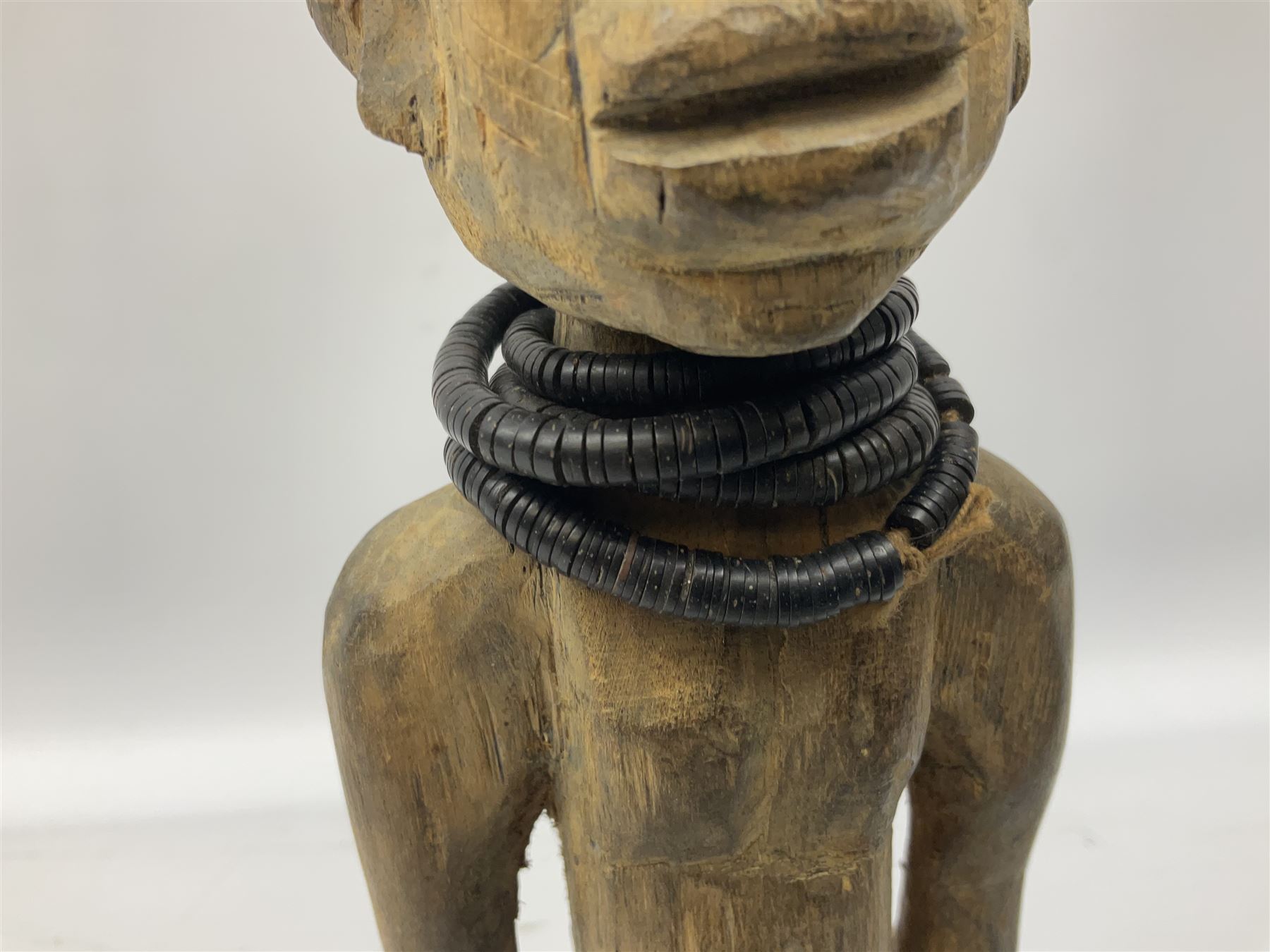 Early 20th century West African Yoruba family wooden figure of Orisha Oko, the god of farming/agriculture, carved from the solid, bears manuscript label of provenance verso H26.5cm
