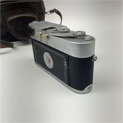 Leica M3 camera body, 1959, chrome finish, serial number '986937', fitted with 'Ernst Leitz GmbH Wetzlar Summicron f=5cm 1:2 Nr.1592614' lens, with Leica M3 instruction booklet
