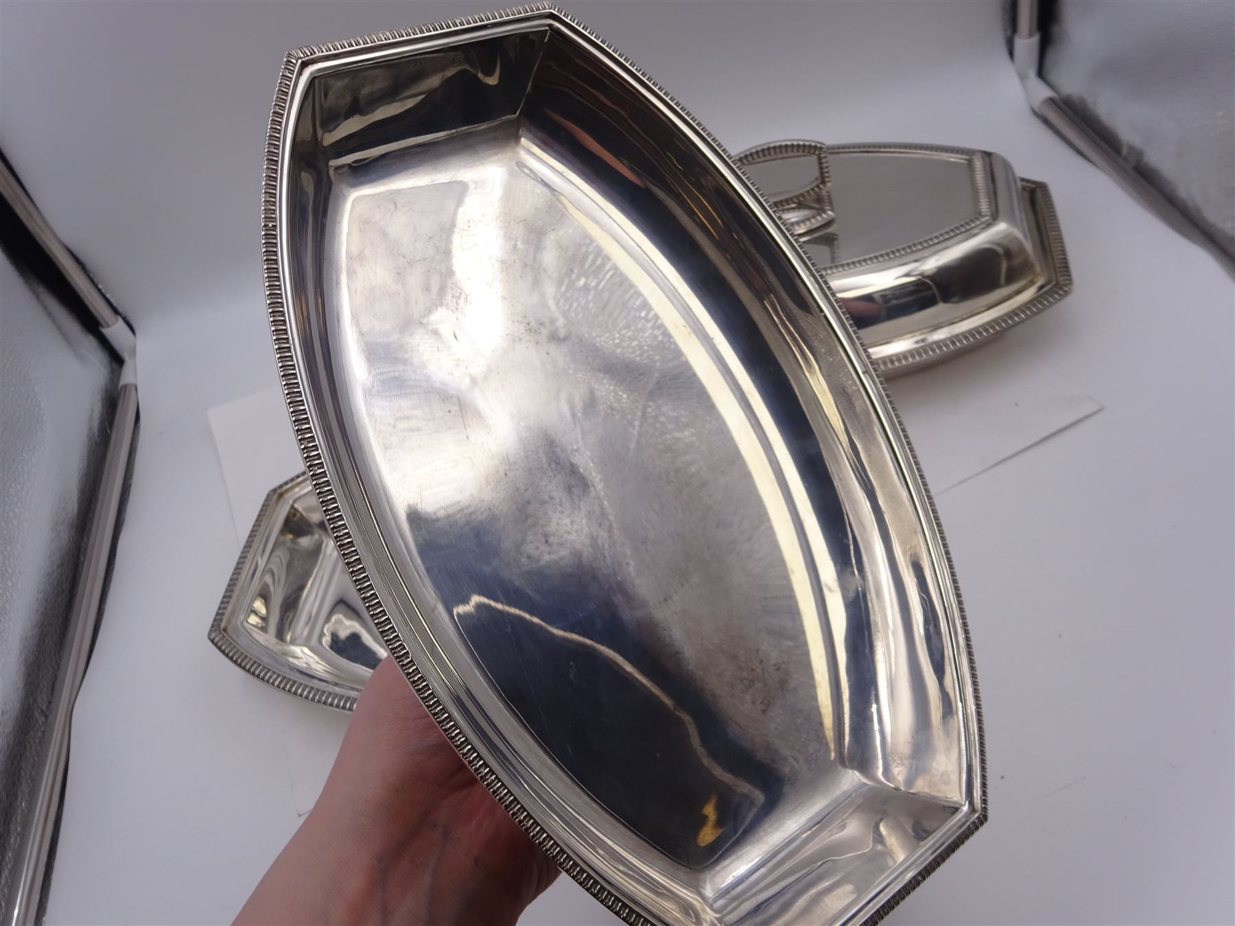 Pair of 1930s silver serving dishes with covers, each with removable handles, hallmarked Barker Brothers Silver Ltd, Birmingham 1935, L27.5cm, H12cm