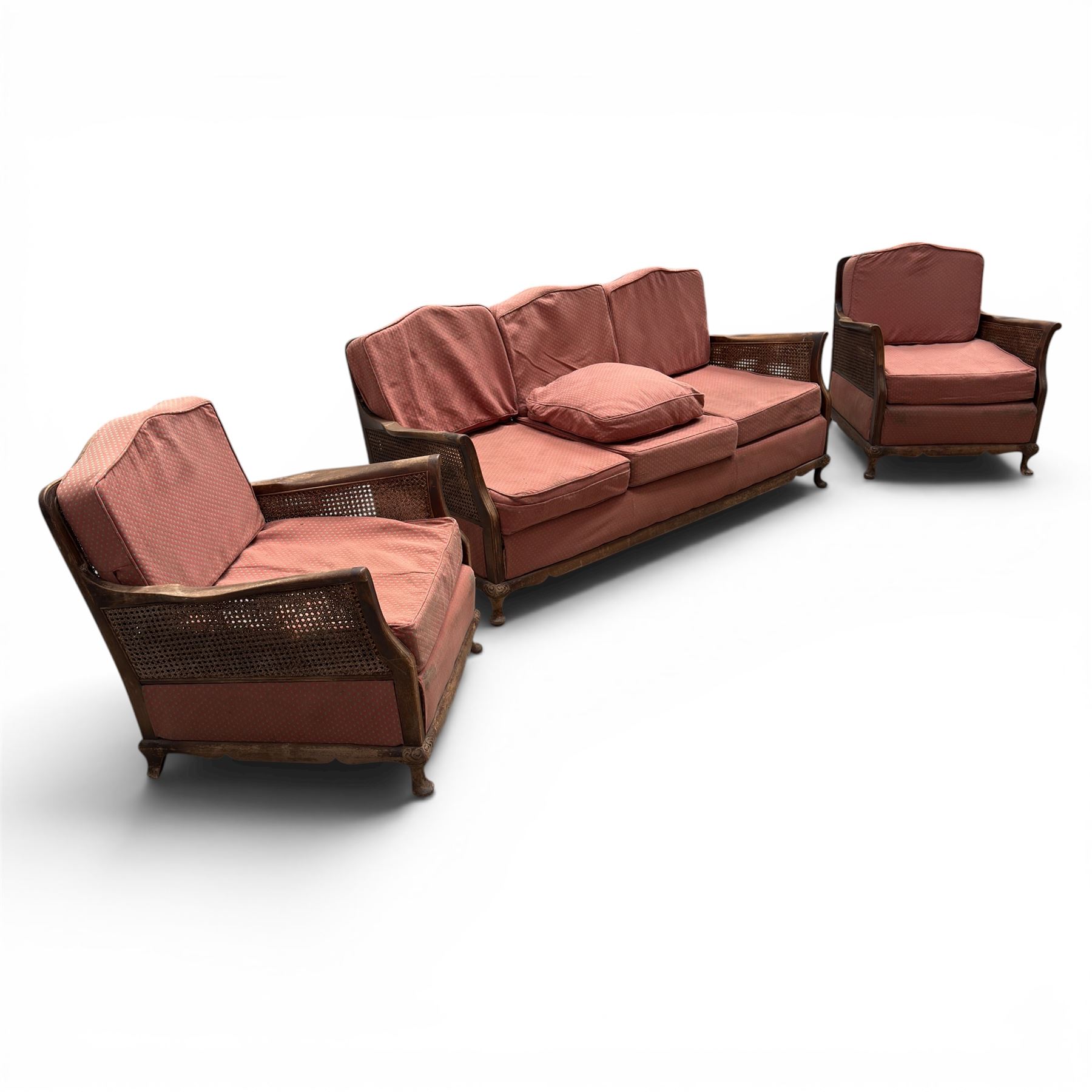 Early 20th century French style bergère conservatory suite, canework back and sides with red upholstered loose seat cushions, on cabriole feet