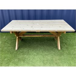 Alexander Rose - large pine rectangular garden table on x-frame end supports joined by pegged stretcher 

 - THIS LOT IS TO BE COLLECTED BY APPOINTMENT FROM DUGGLEBY STORAGE, GREAT HILL, EASTFIELD, SCARBOROUGH, YO11 3TX