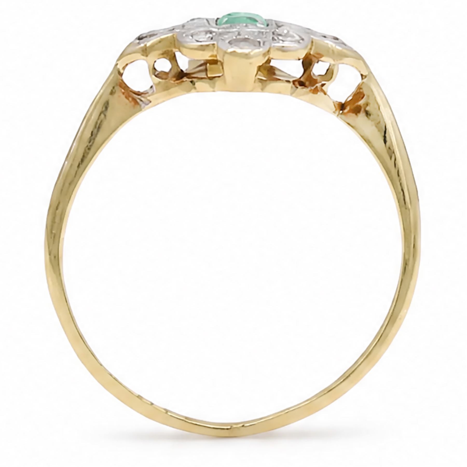 Early 20th century gold and platinum emerald and diamond panel ring, single rectangular cut emerald, surrounded by eight single cut diamonds, stamped 18ct & PT